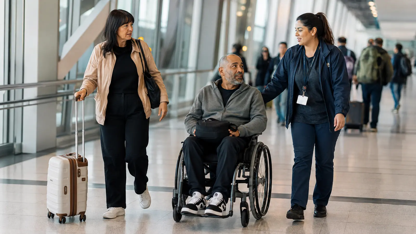 Wheelchair user receiving assistance during an airport connection