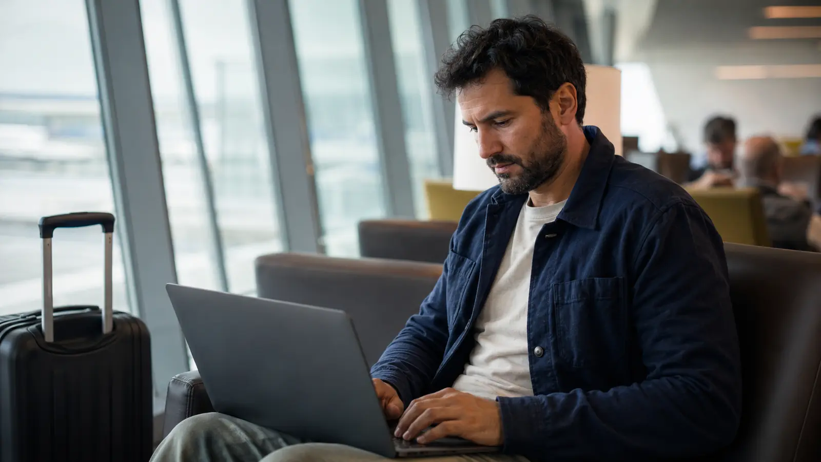 Traveller reviewing an existing flight booking on a laptop